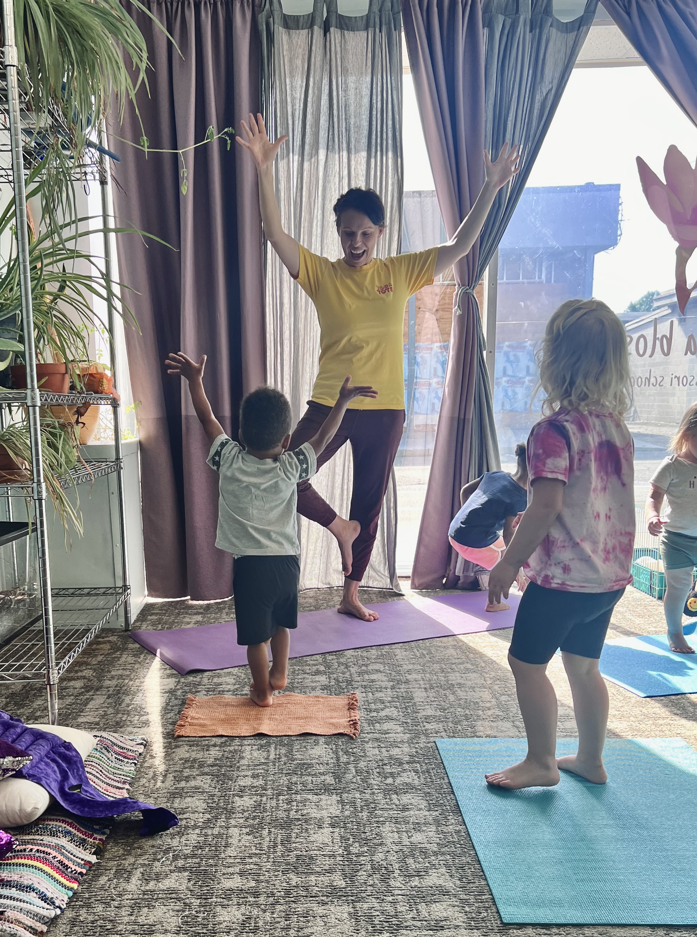 Emina teaching children's yoga